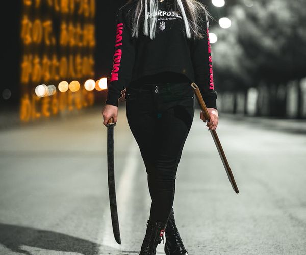 Silhouette of a person in a strong warrior yoga pose.